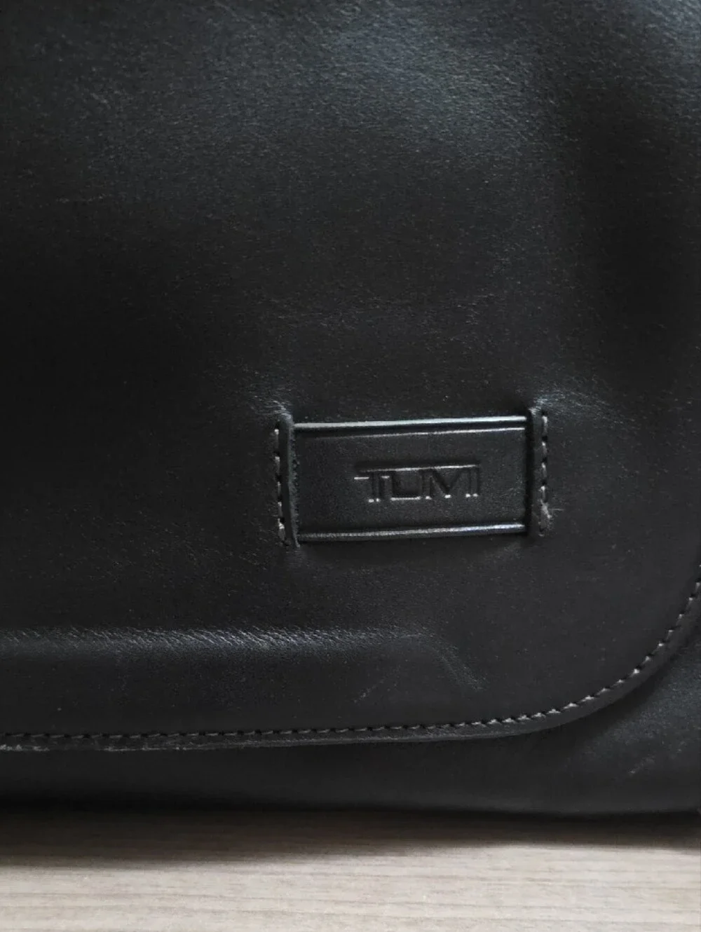Tumi Black Leather Messenger Bag with Adjustable Strap